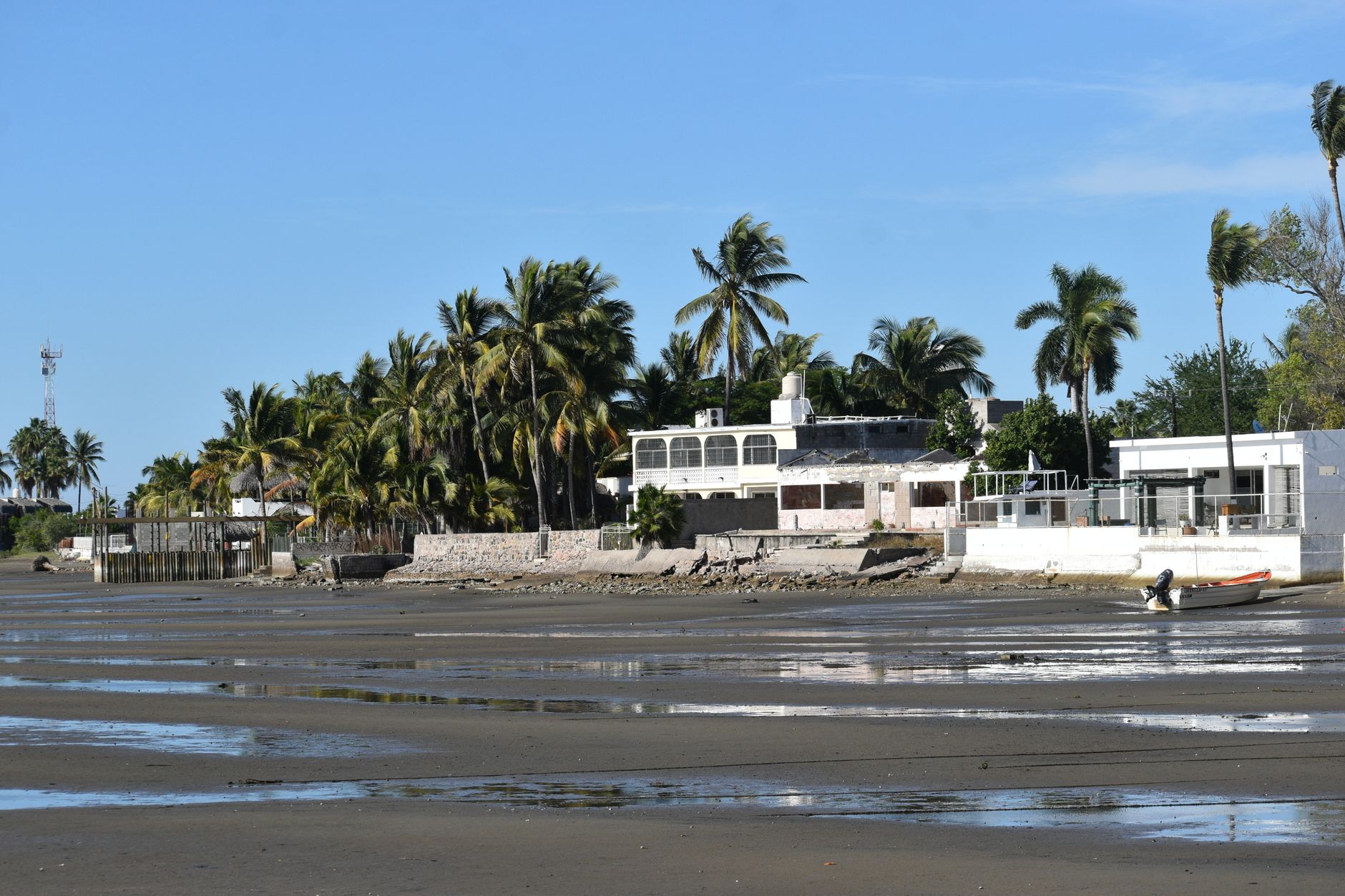 Luxury beachfront mansion with private pool and panoramic ocean view, available for sale.